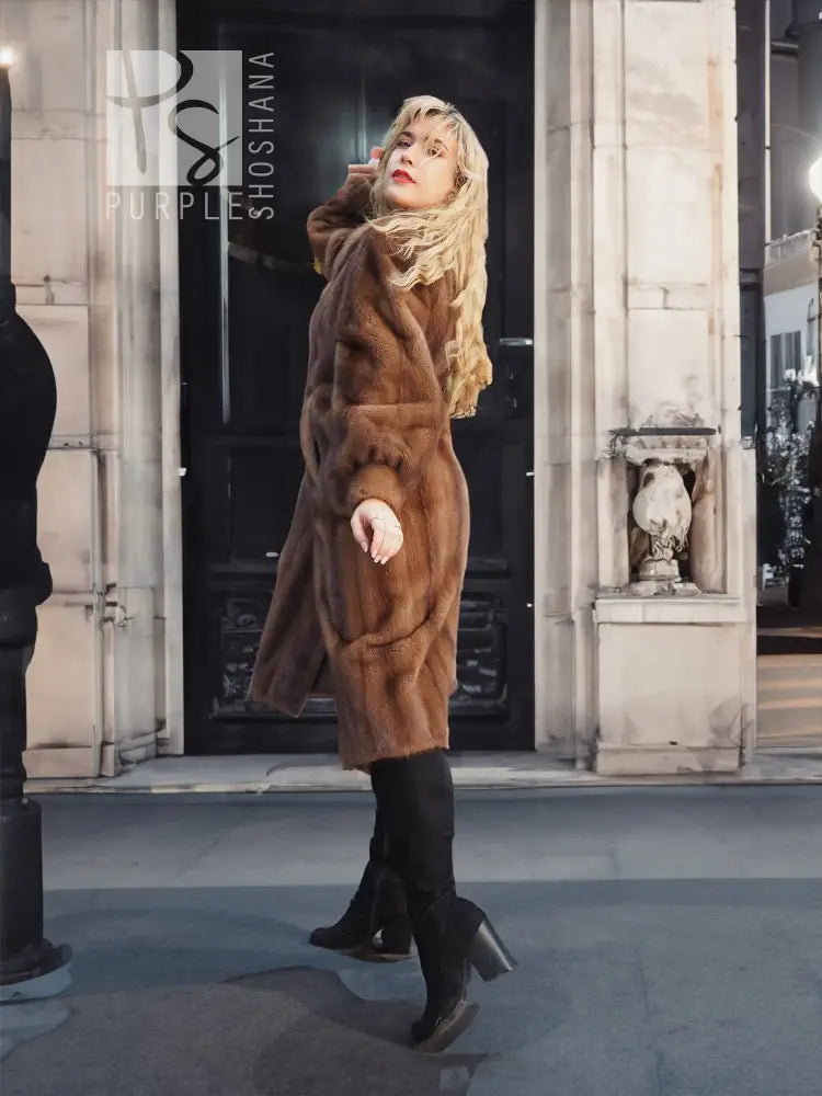 Women's brown mink fur coat, full-body view with plush collar and long sleeves.
