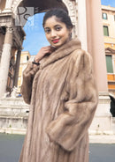 Light brown mink fur coat with hood, three-quarter view showing thick fur texture.