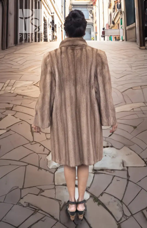Light brown mink fur coat with hood, back view with full skirt length.