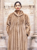 Light brown mink fur coat with hood, front view and zipper-free center seam.