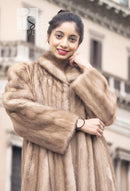 Light brown mink fur coat with high fur collar and front opening, close-up