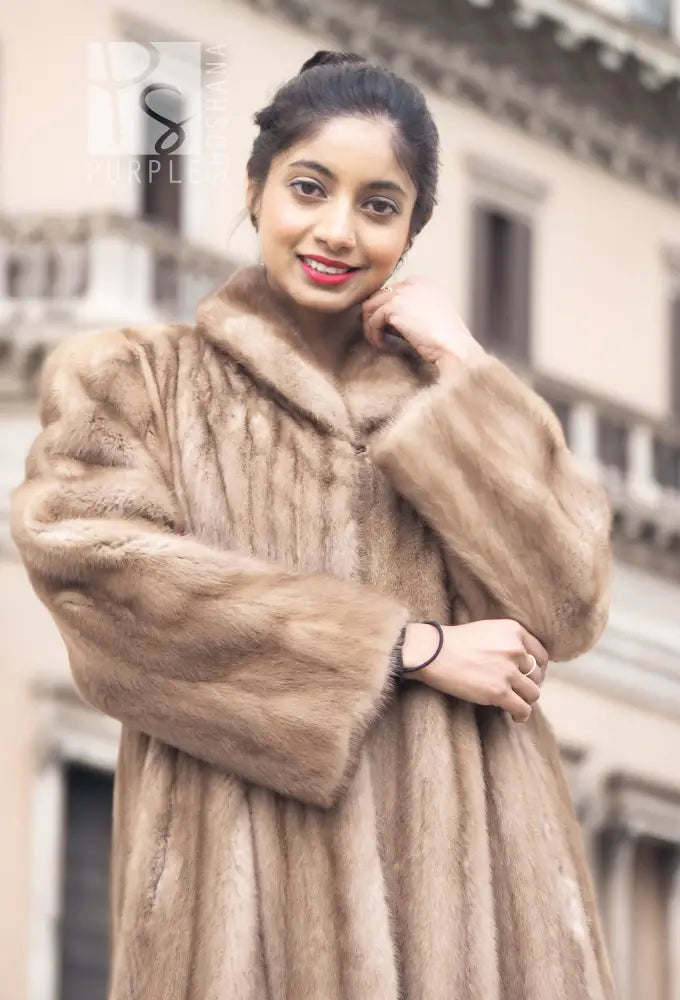 Light brown mink fur coat with high fur collar and front opening, close-up