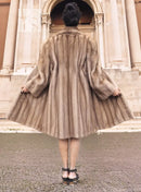 Light brown mink fur coat, back view with flared skirt and full sleeves