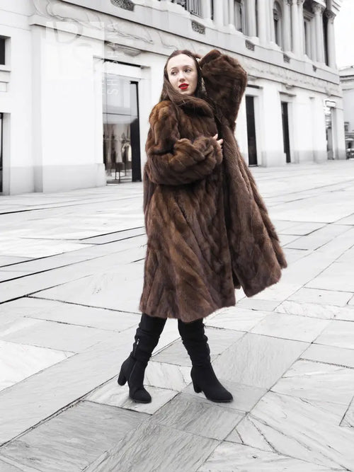 Brown mink fur coat with plush hood and roomy sleeves, front view