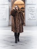 Brown mink fur hooded coat, full length, front view with relaxed stance