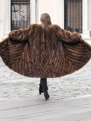 Mink fur swing coat with hood, brown directional stripe texture, back view