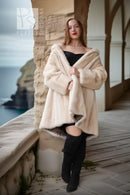 Pearl mink swing coat with hood, cream fur, wrap-style front, flared sleeves