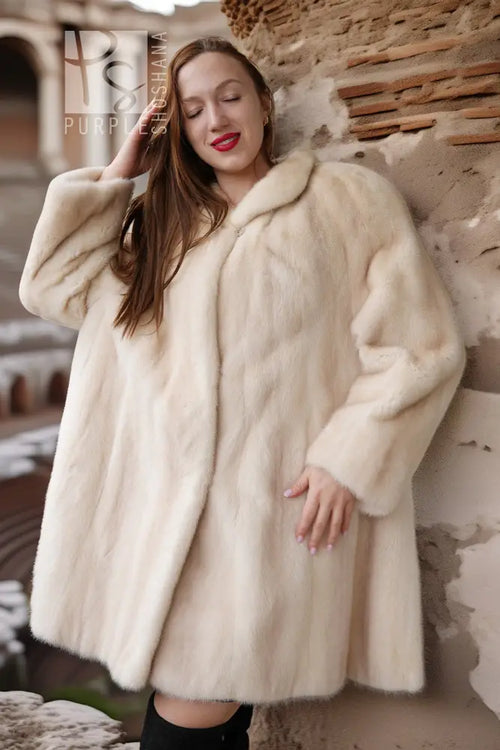 Cream mink coat with soft standing collar and wide, flared swing sleeves
