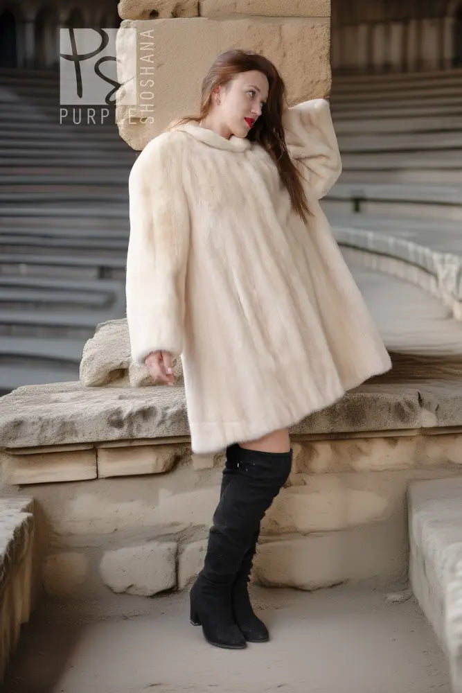 Cream mink coat, side view with plush collar and voluminous swing shape