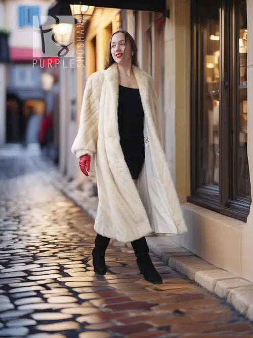 Cream fur coat with open front and shawl collar; full-length street view