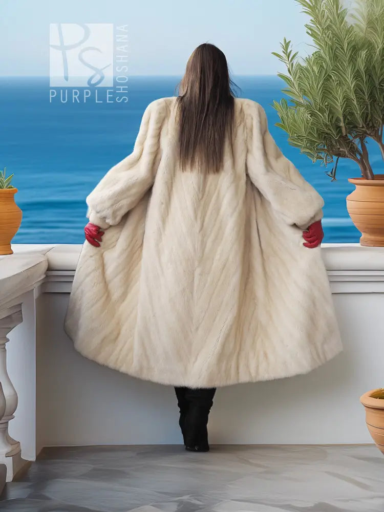 Cream fur coat, long flared silhouette with open front; back view