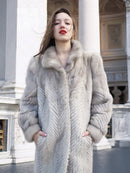 Light gray herringbone mink coat, front view with fur collar framing the face