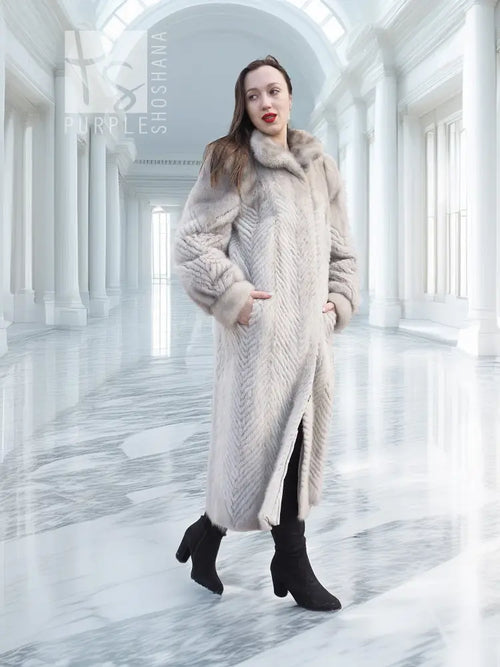 Hooded herringbone mink fur coat in light gray, open front, long midi hem.
