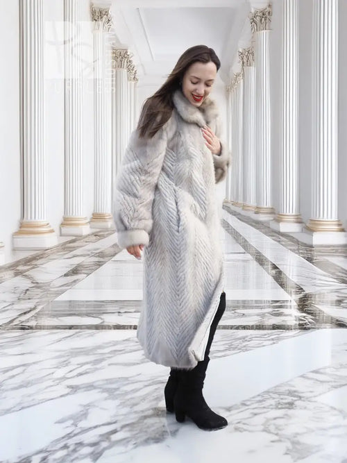 Light gray herringbone mink-style long coat with plush hood and open front.