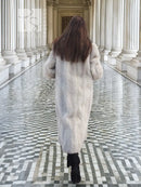 Back view: hooded herringbone mink fur coat in light gray, long midi length.