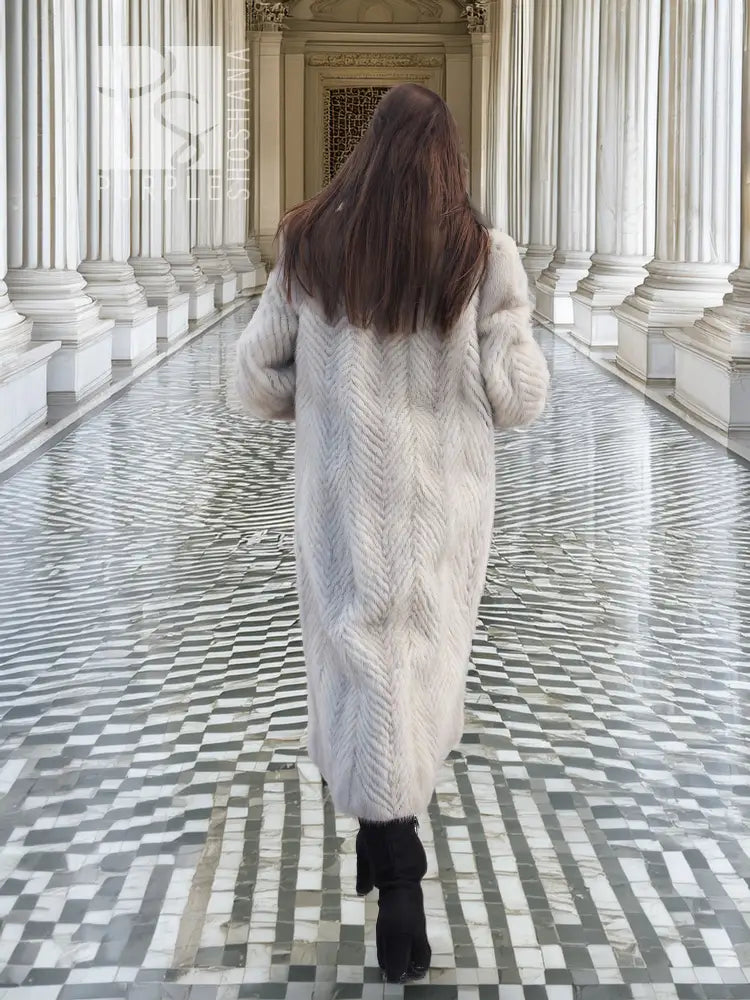 Back view: hooded herringbone mink fur coat in light gray, long midi length.