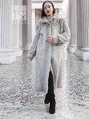 Light gray herringbone mink coat, walking pose with open front and fur collar