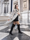Hooded mink fur coat with herringbone texture, light gray; open front with dark leggings.