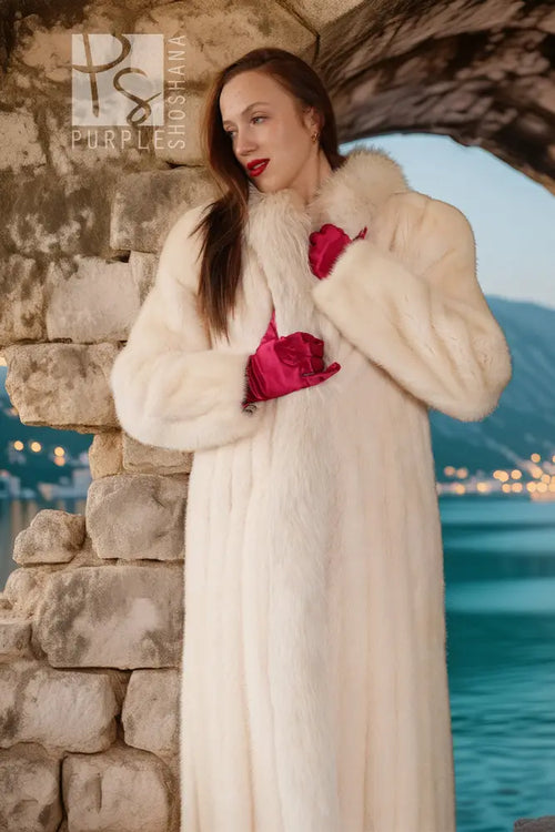 White mink fur coat with fluffy collar and red fox-trim accents, long sleeves, buttonless