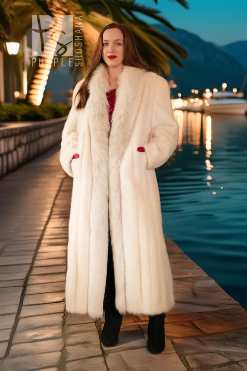 White mink fur coat with fox trim, full-length look with red cuffs at wrists