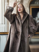 Sheared beaver full-length coat with wide collar and textured dark gray sleeves