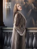 Profile view sheared beaver coat with fold-back cuffs, dark taupe