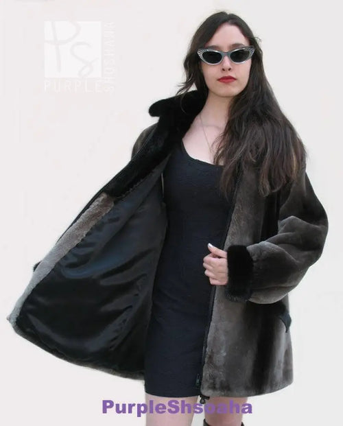 Dark beaver fur bomber coat with front zipper and open side lining detail