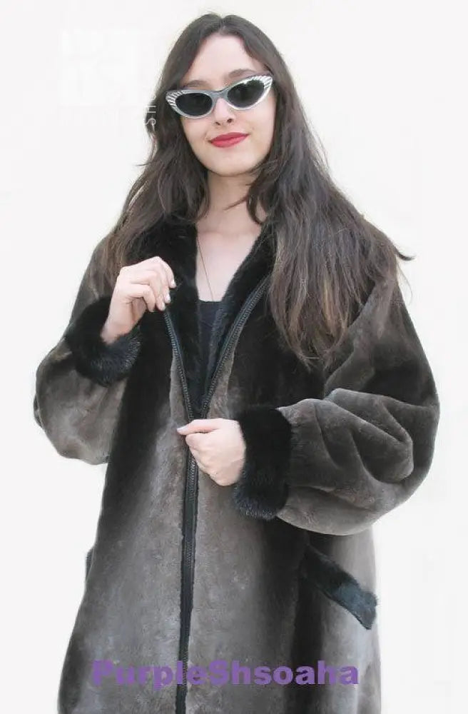 Dark beaver fur bomber coat with hood and front zipper, front close-up