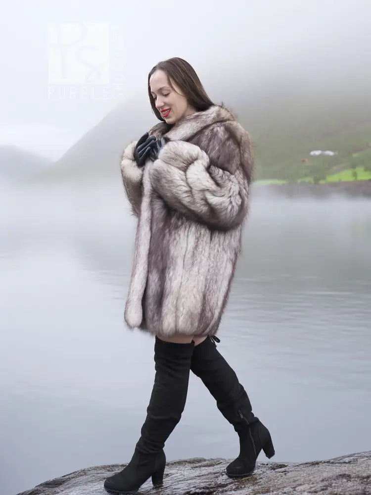 Light gray plush fur coat with shawl collar, long sleeves, worn with dark boots