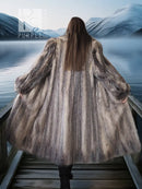 Back view plush fur coat, textured fur surface and flared skirt at hem