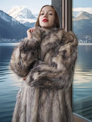 Gray-brown plush fur collar and shoulders on long fur coat, close-up front