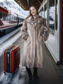 Plush fur coat with shawl collar, full length and wide shoulders over black boots