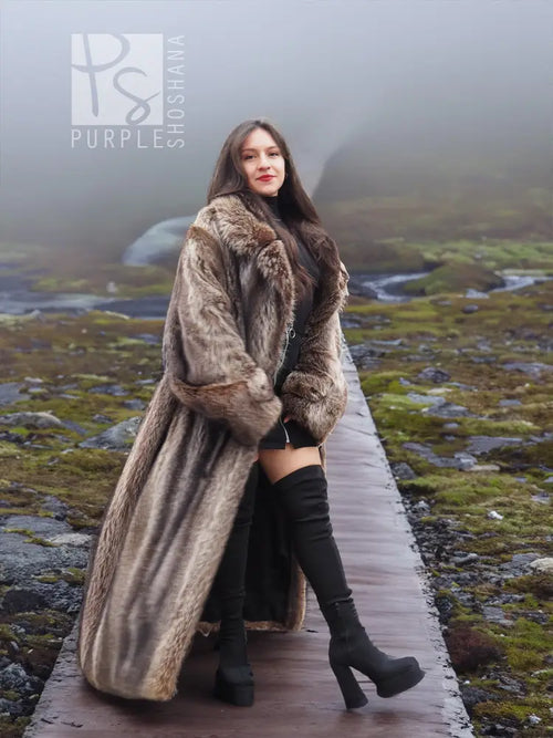 Raccoon fur coat for men, long hooded style with belt at waist and plush fur texture.