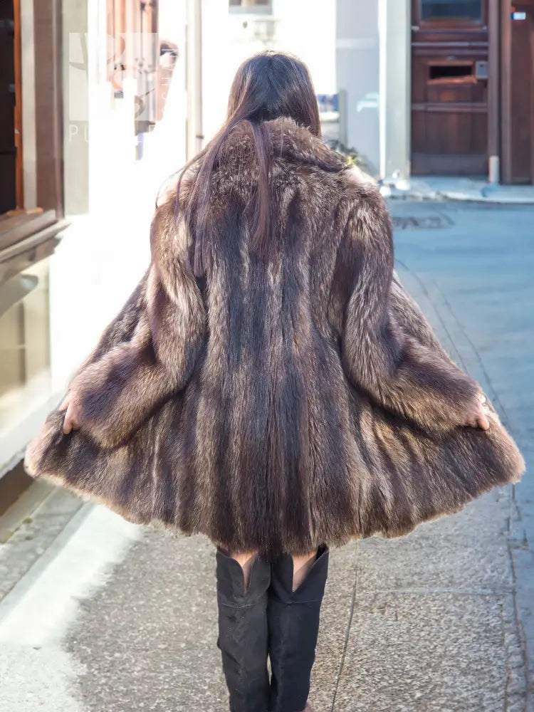 Back view raccoon fur coat with full skirt hem and wide collar, brown.