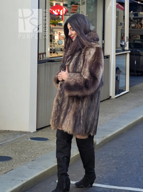 Raccoon fur coat, full-length with draped texture and side pockets, brown.