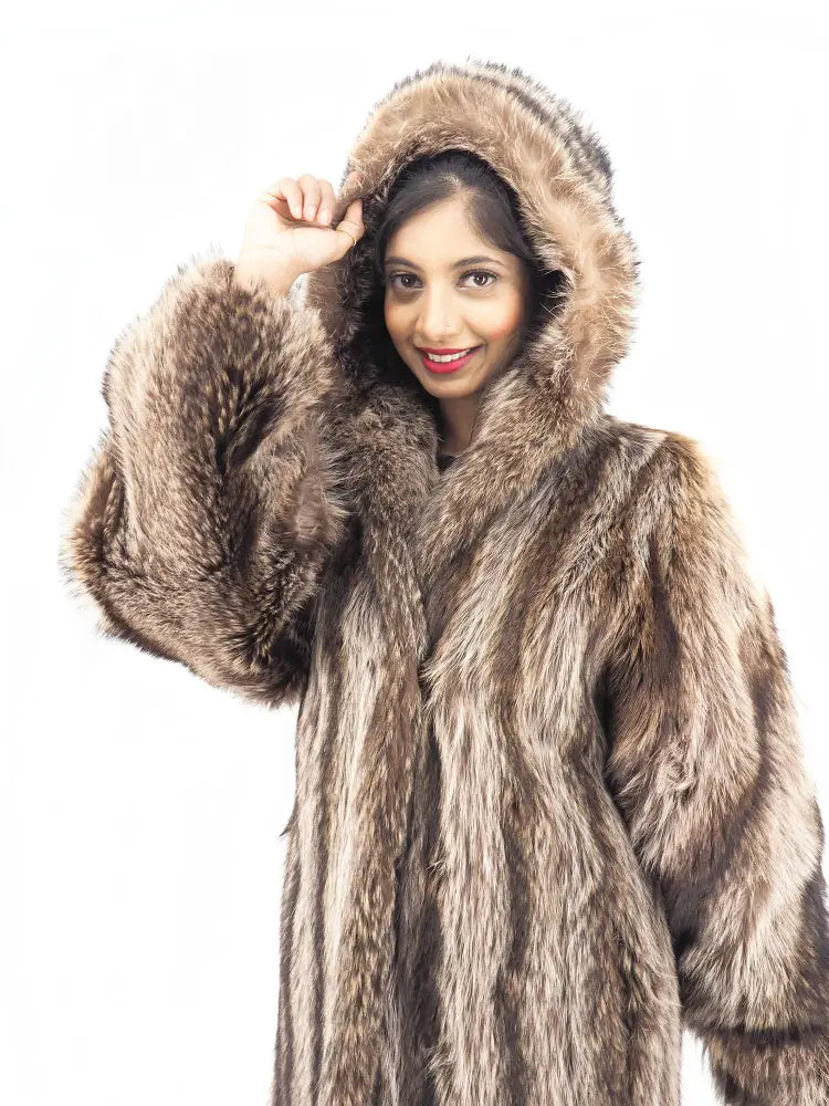 Raccoon fur coat with hood, close-up showing hood framing around face