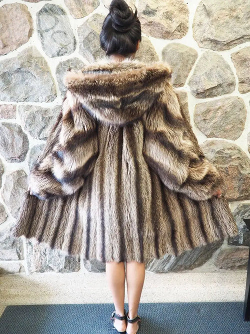 Raccoon fur coat with hood, full back view with layered fur panels
