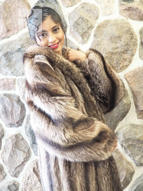 Raccoon fur coat with hood, close-up of shoulder and sleeve fur detail