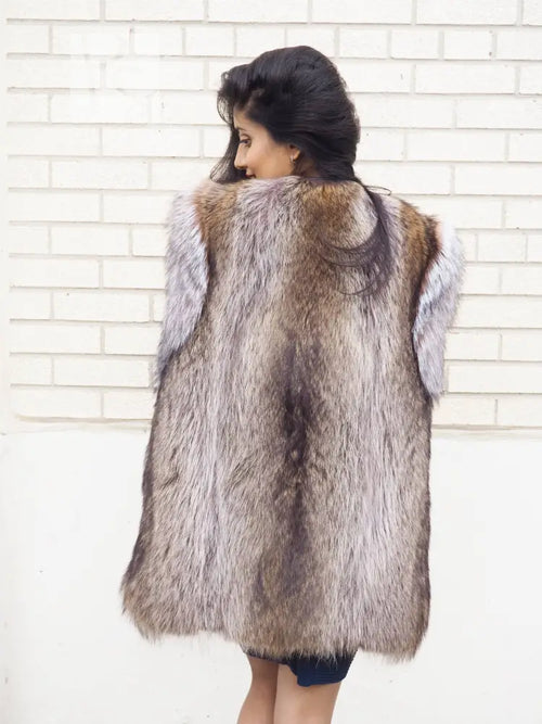 Back view of unisex raccoon fur vest with light fur trim on shoulders