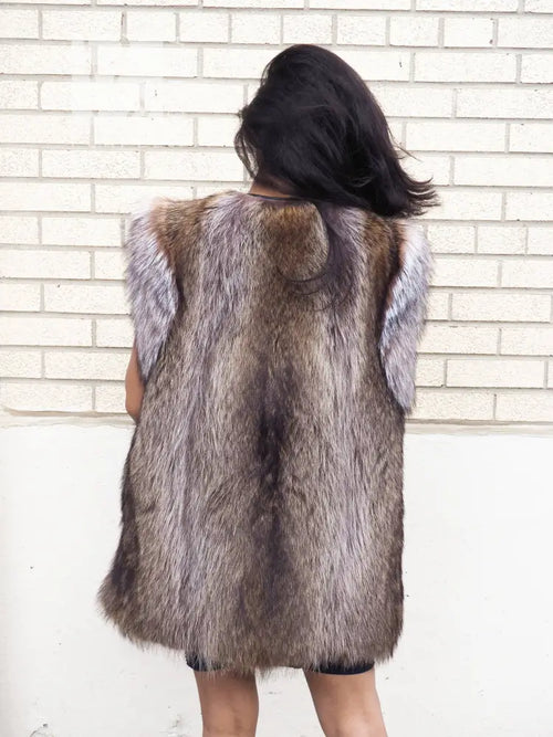 Back view of raccoon fur vest with full fur coverage and light trim detail