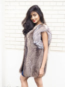 Side view raccoon fur vest with plush fur texture and contrasting light shoulder trim