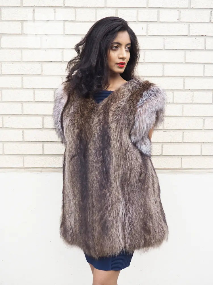 Raccoon fur vest with fox-fur trim, sleeveless V-neck, gray-brown, front view