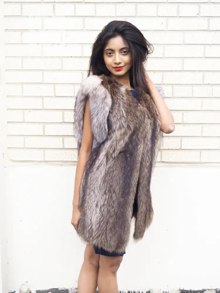 Unisex raccoon fur vest in dark taupe gray with light fur trim along edges