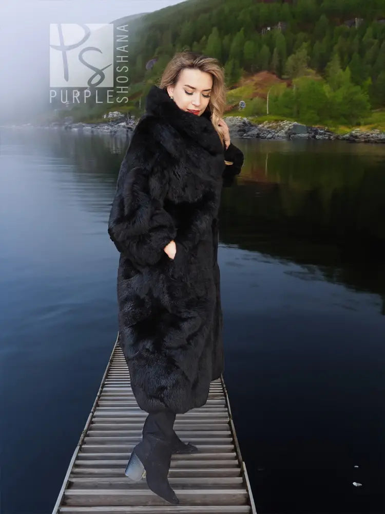 Black long plush fur coat with wide collar and full-length faux-fur body.