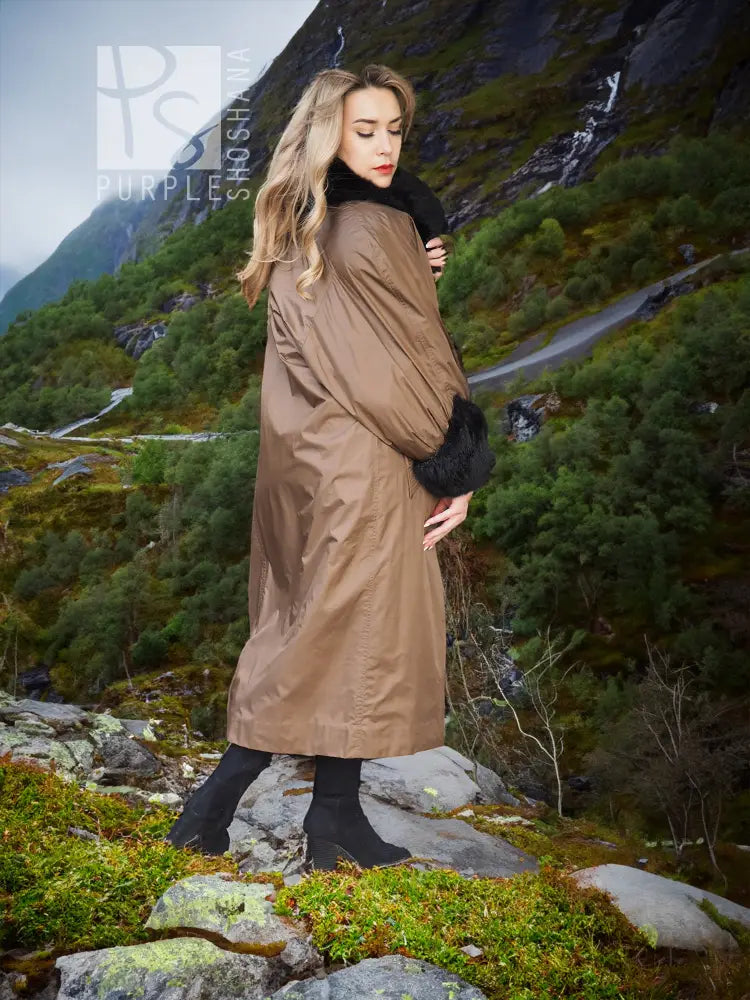 Reversible water-repellent tan coat with black plush sleeves and cuff trim.