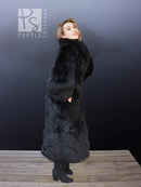 Black reversible plush coat with thick faux-fur texture and full-length sleeves.