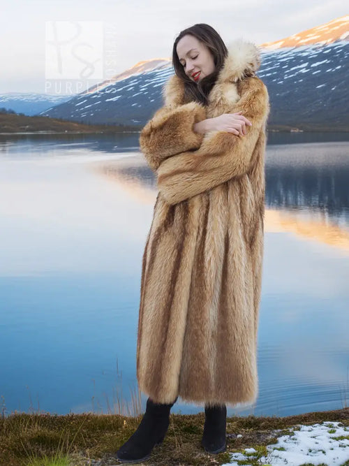Raccoon fur coat in tan with a straight, full-length silhouette and shawl collar.
