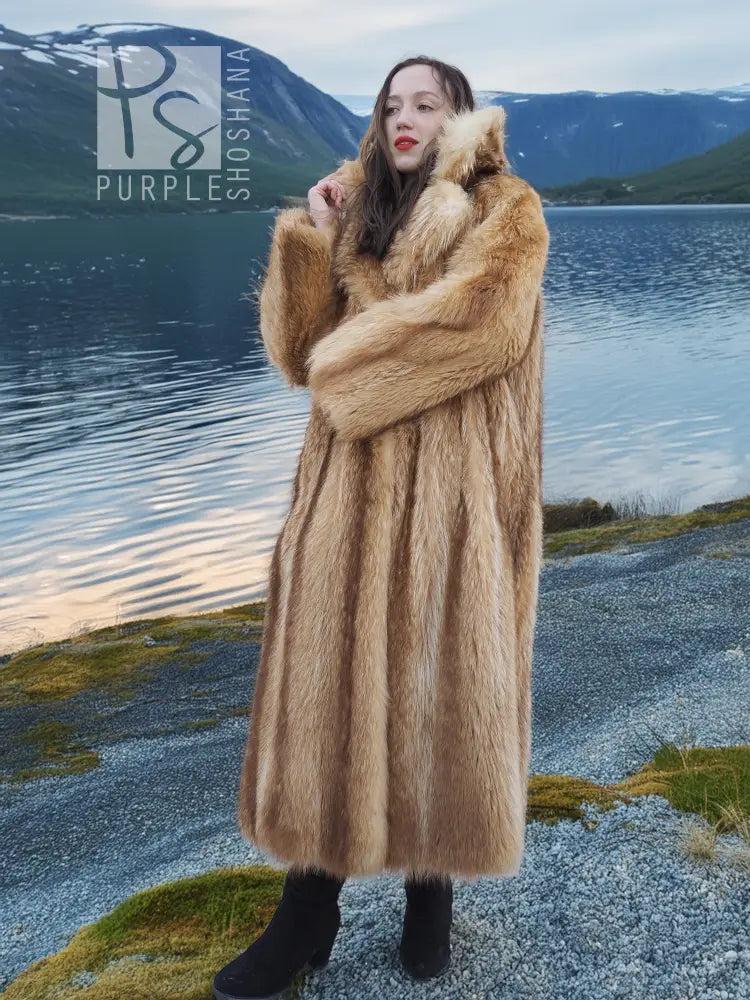 Tan raccoon fur coat with thick shawl collar and plush sleeves, arms-crossed portrait.