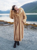 Tan raccoon fur coat with thick shawl collar and long sleeves, angled side view.