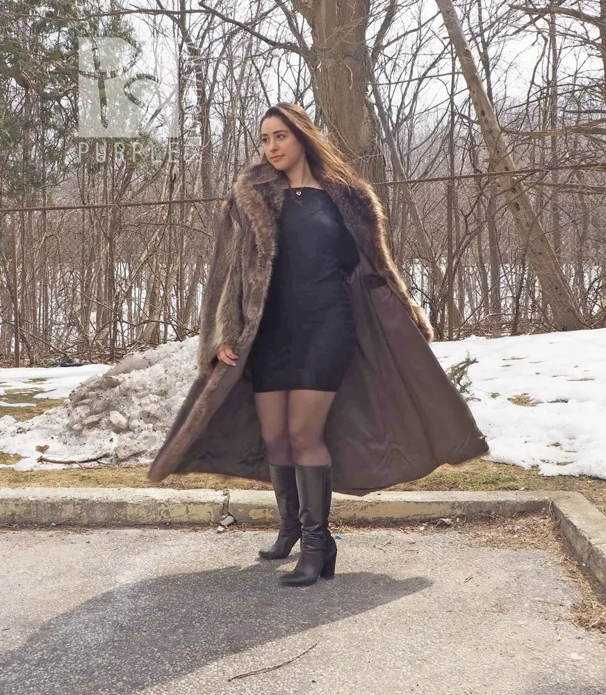 Reversible raccoon fur coat with dark outer layer and light fur hood trim, open front